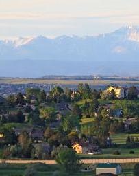 Landscape view of Centennial, Colorado neighborhood with the Rocky Mountains in the background